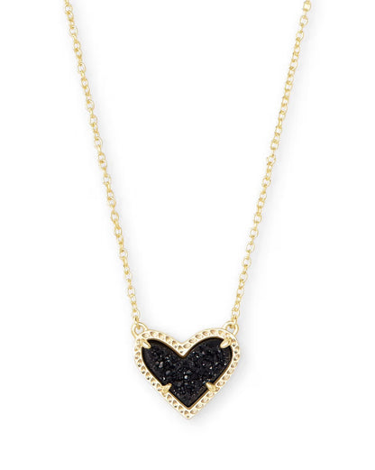 Gold heart pendant necklace with textured black center, beaded gold border. Available in 15", 17", and 19" lengths.