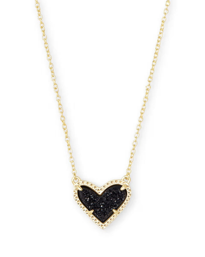 Gold heart pendant necklace with textured black center, beaded gold border. Available in 15", 17", and 19" lengths.