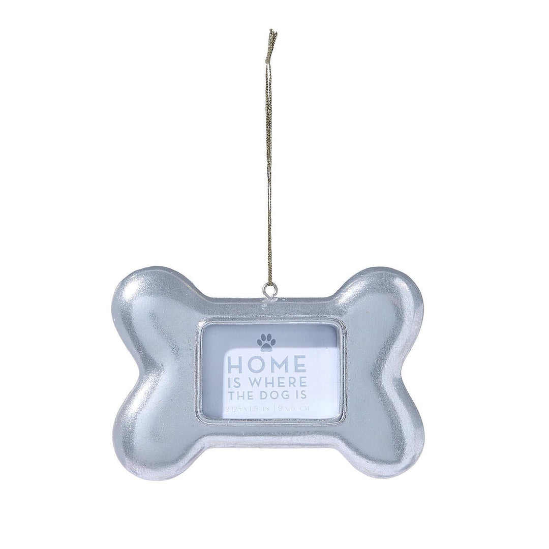 Silver, bone-shaped Dog Bone Photo Ornament, 2.125 by 1.5 inches, with a central rectangular frame, “Home is where the dog is” text, and a paw print icon.