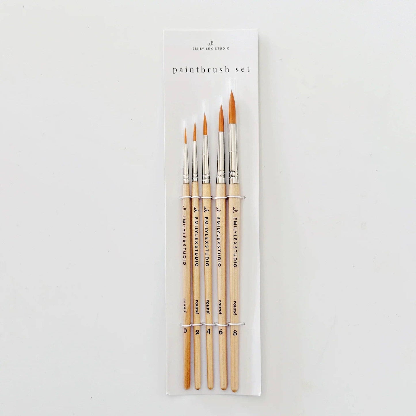 Watercolor Paintbrush Set of five wood brushes with taklon bristles in sizes 0, 2, 4, 6, and 8. In a labeled plastic bag.
