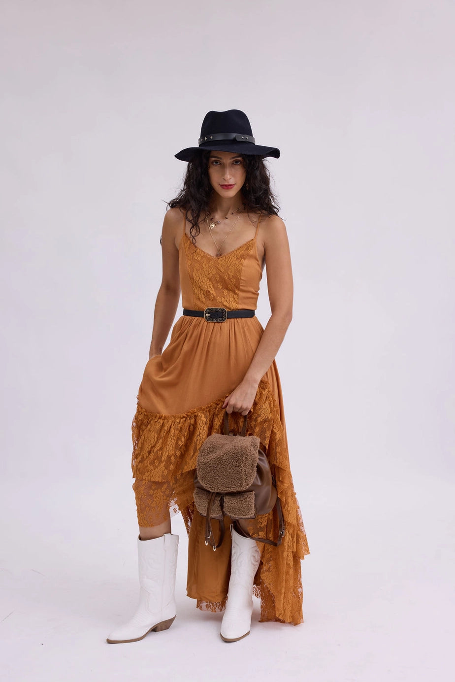 The Riviera Sparkle Skinny Belt is a sleek accessory designed to cinch dresses or tops. It features an elegant sparkle detailing for added glamour. Available sizes: XS, S, M, L, XL.