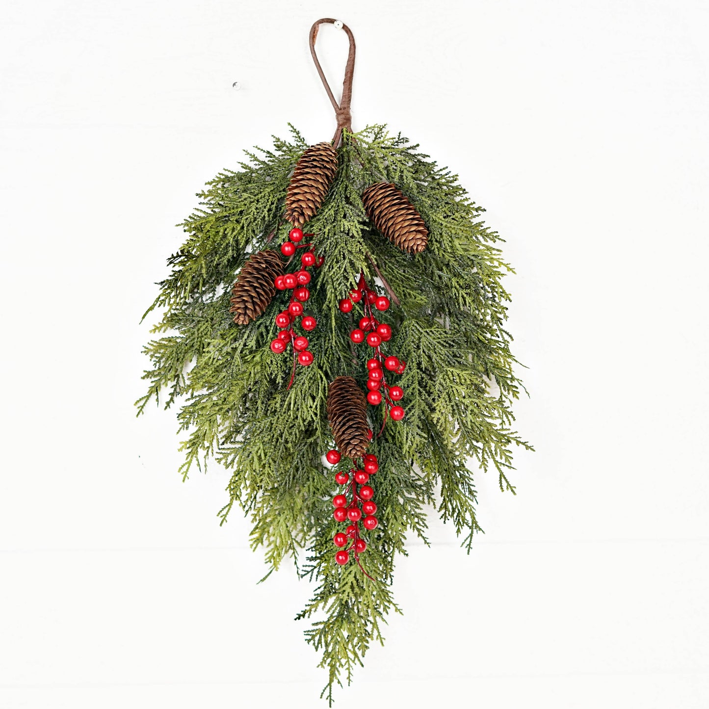 Festive 510053 teardrop hanging decoration, 26inLx16inW, with real touch cedar foliage, pinecones, red berry accents, and brown loop.