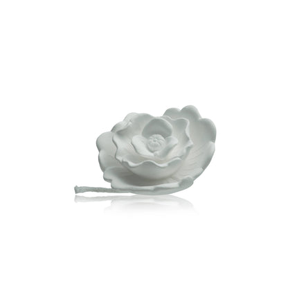 White ceramic rose diffuser with layered petals and short braided cord; available sizes: small, medium, large.