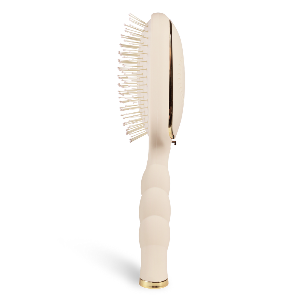 Detangler Hair Brush for Medium Hair - Tan; side view shows a curved beige handle with texture, white bristles with bead tips, gold accents; available in medium size.