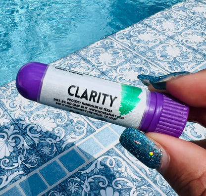 Purple aromatherapy inhaler labeled "Calm," available in travel and standard sizes.