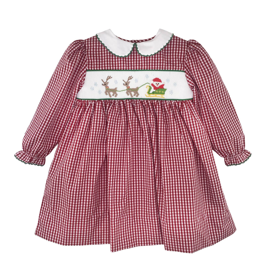 Red and white gingham Christmas dress with long sleeves, white Peter Pan collar, and hand-smocked reindeer and sleigh panel.