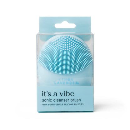 Light blue silicone sonic cleanser brush in clear box. Antibacterial. Available in standard size. For gentle exfoliation.