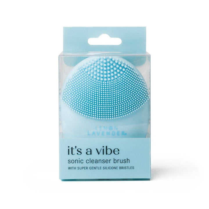 Light blue silicone sonic cleanser brush in clear box. Antibacterial. Available in standard size. For gentle exfoliation.