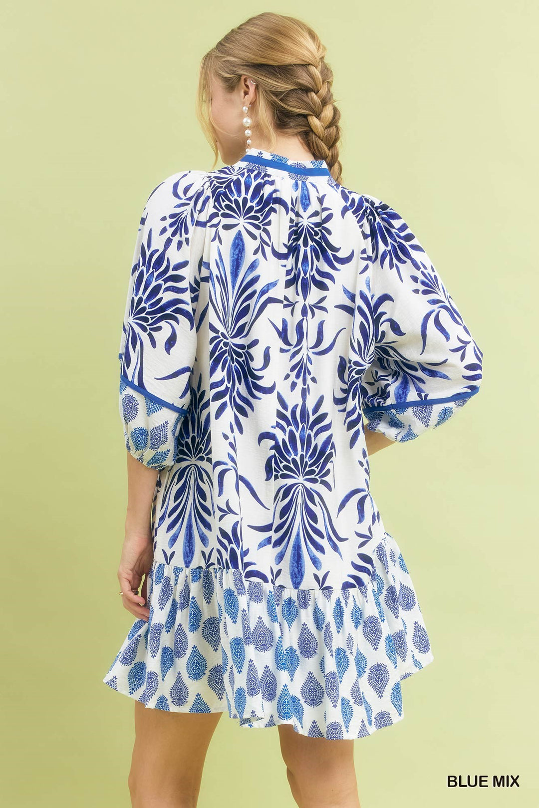 Marina Blue Mix Babydoll Dress with white and blue floral patterns, available in sizes XS-XL. "BLUE MIX" text in corner.
