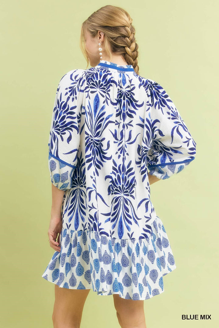 Marina Blue Mix Babydoll Dress with white and blue floral patterns, available in sizes XS-XL. "BLUE MIX" text in corner.