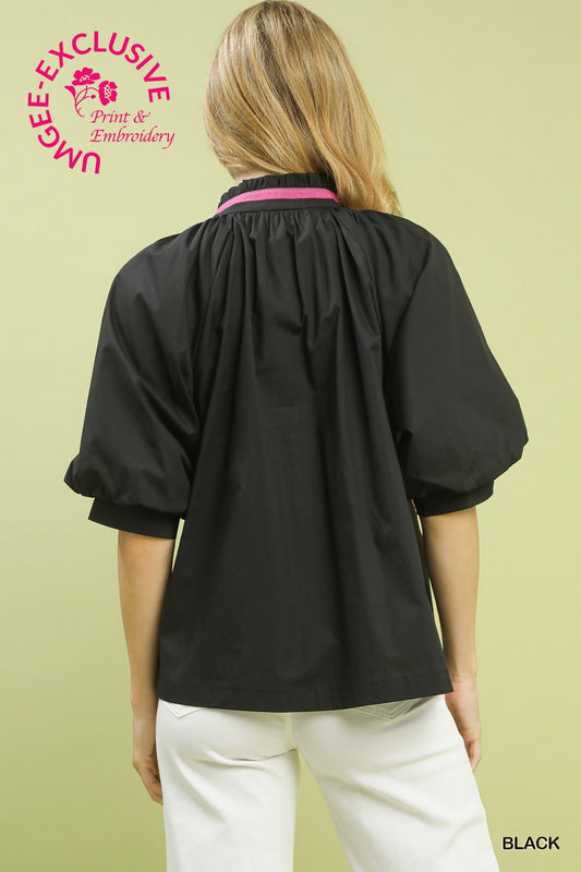 Fiona Embroidered Floral Blouse: loose black cotton top with puff sleeves and unique floral embroidery, available in sizes XS–XL.