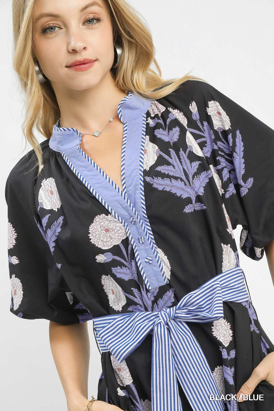 Carol Floral Print Midi Dress with black and blue florals, purple embroidery, striped belt; available in sizes XS-XL.