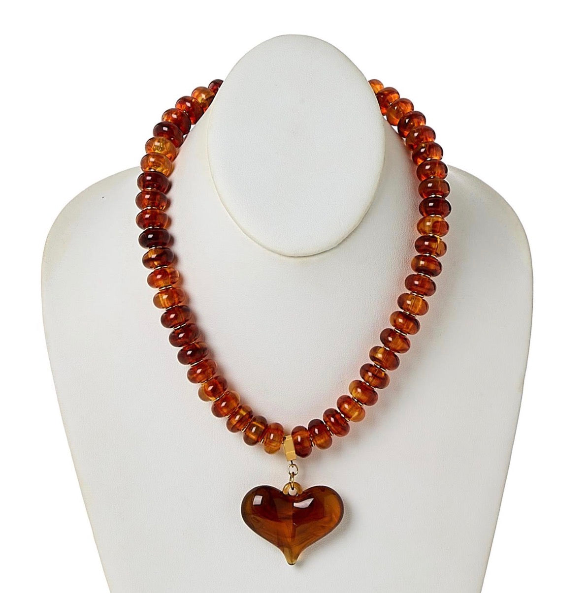 Happy Heart Beaded Necklace featuring chunky translucent amber beads and a heart-shaped pendant; available in multiple sizes.