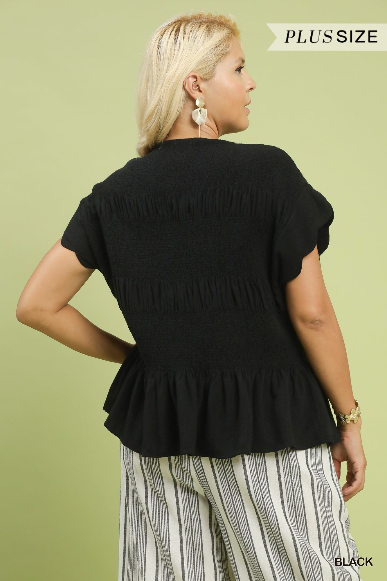 Amelia Smocked Peplum Top in black linen-blend, features gathered back and ruffled hem; available in plus sizes.