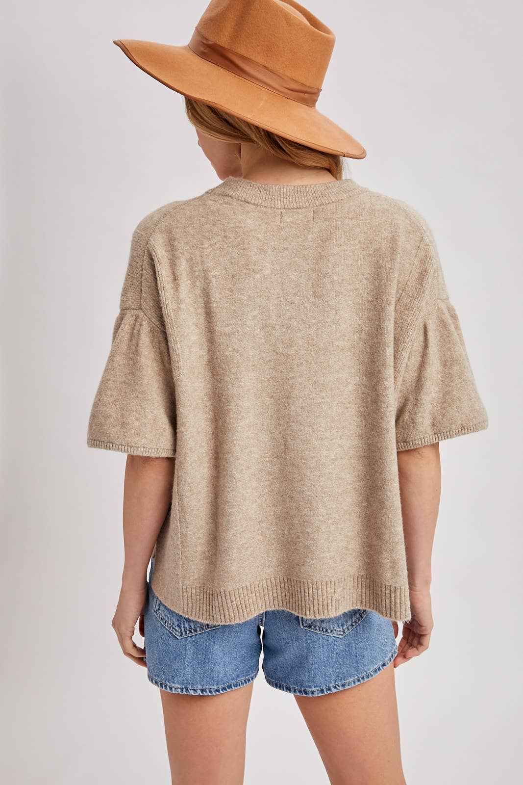 Gathered short sleeve boxy knit sweater top in latte, size S/M. Features heathered knit, crewneck, gathered shoulder detail, and ribbed hem.