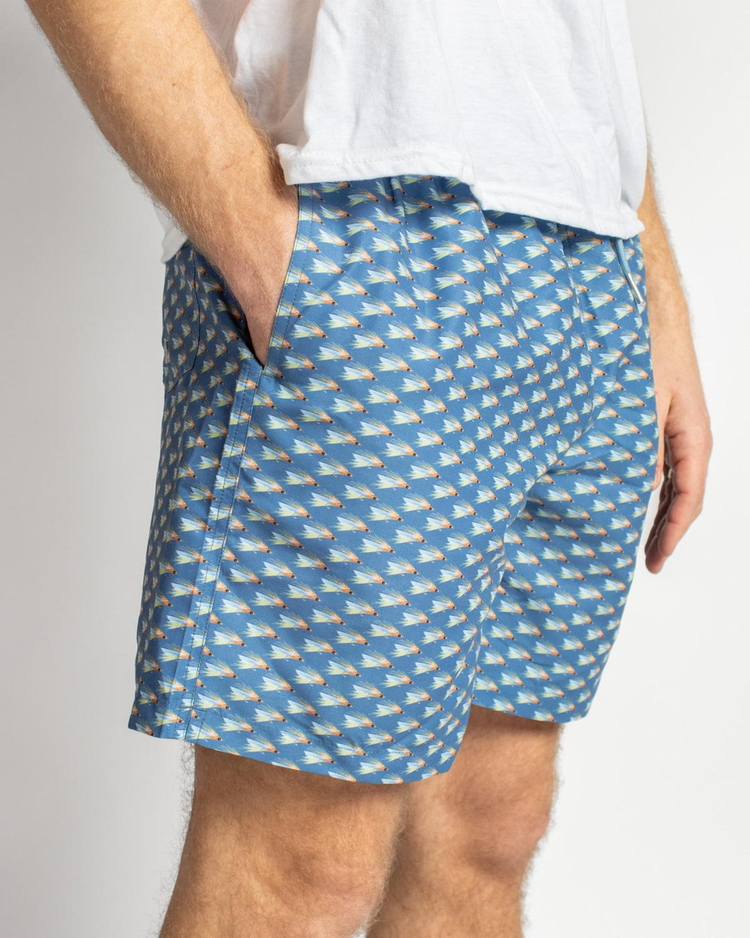 Men’s On The Fly Swim Trunks in blue geometric pattern. Available sizes: S-XXL. Only the shorts are shown, no model detail.