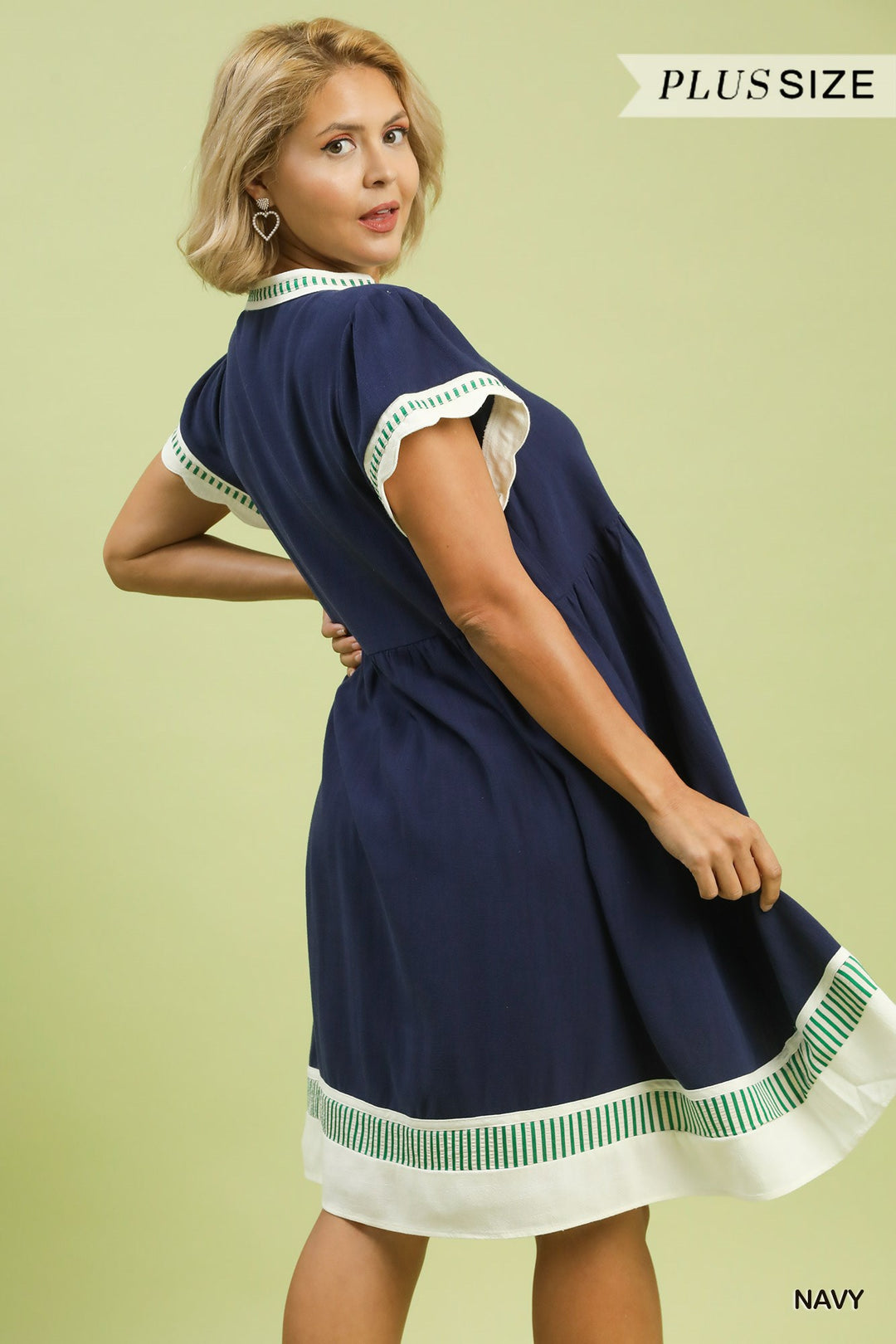 Navy Coast Linen Color Block Dress in navy blue with white and green trim, featuring tiered flutter sleeves. Available in plus sizes. "Plus Size" label shown.