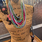 Long Strand Beaded Necklaces in blue, pink, green, and purple. Available in 24", 30", and 36" lengths.