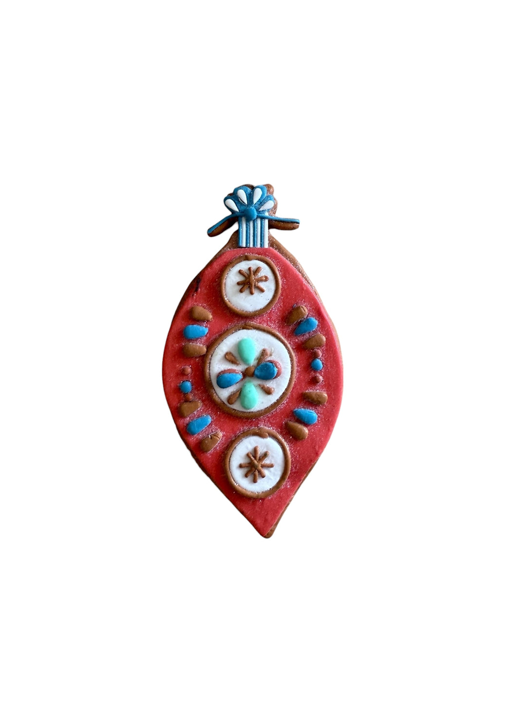 Teardrop-shaped clay dough ornament in red, white, and blue with floral and dot details. Available in various sizes.