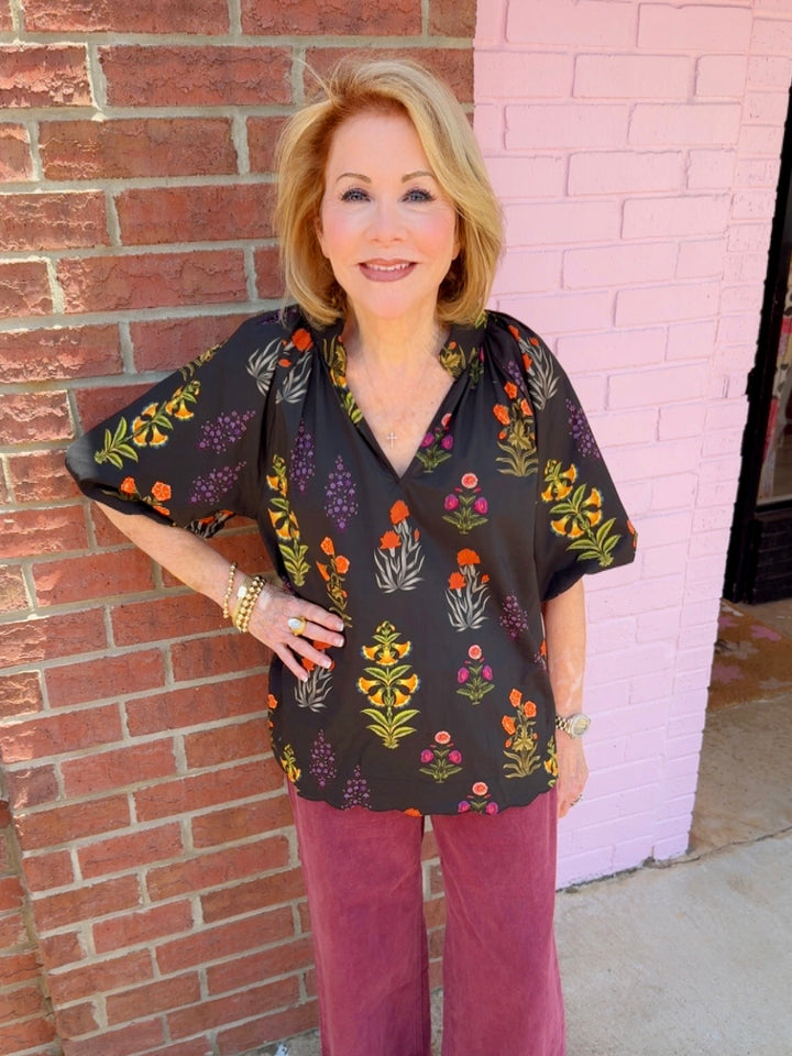 Maisie Floral Scallop Top featuring a floral pattern and scalloped edges. Available in sizes XS–XXL.