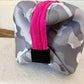 The Olivia Small Neoprene Makeup Bag is gray and white camo with a pink zipper and black loop, available in small size.
