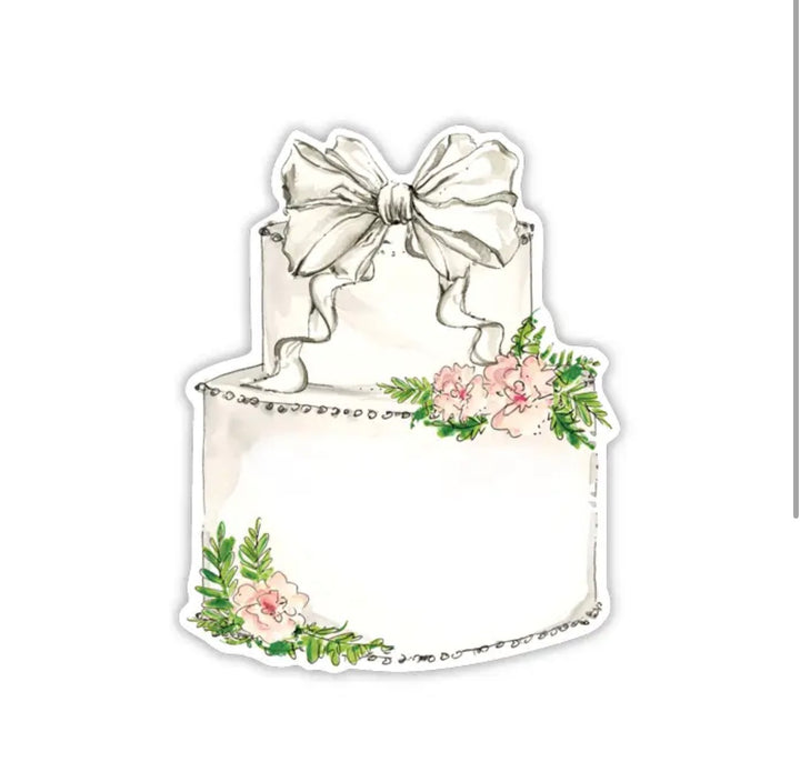 Two-tier white cake with large bow, pink flowers, and green leaves. Available sizes: small, medium, large.