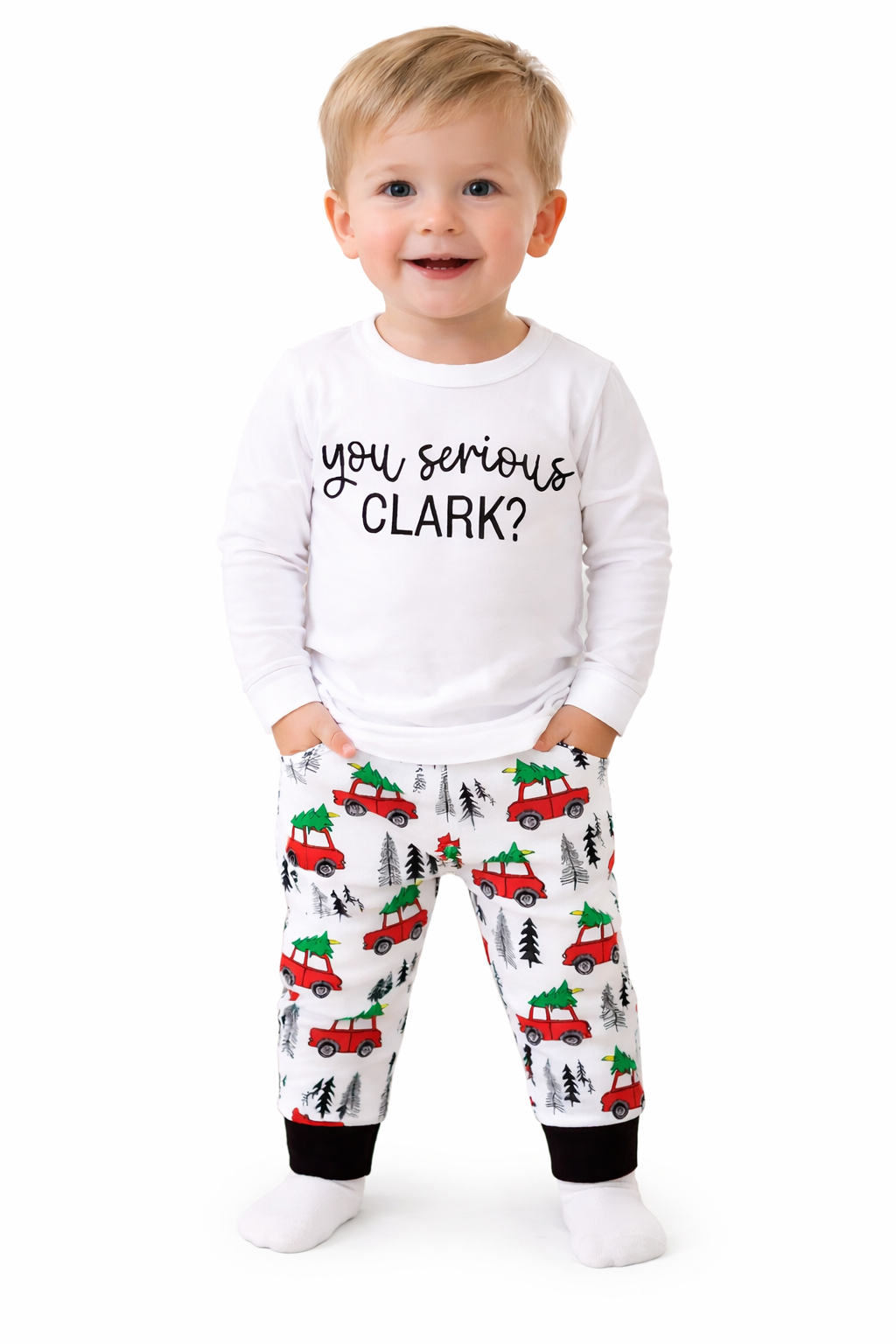 “You Serious Clark? Cotton 2-Piece Boy Clothes Set” includes white pajamas with red trucks and trees and a cotton long sleeve shirt printed with “You serious CLARK?”. Available in sizes 3-4T.
