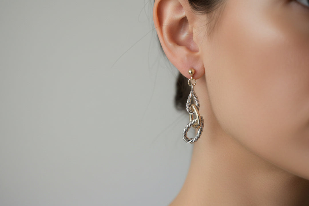 Metallic, twisted, leaf-inspired drop earrings. Available in small, medium, and large sizes.