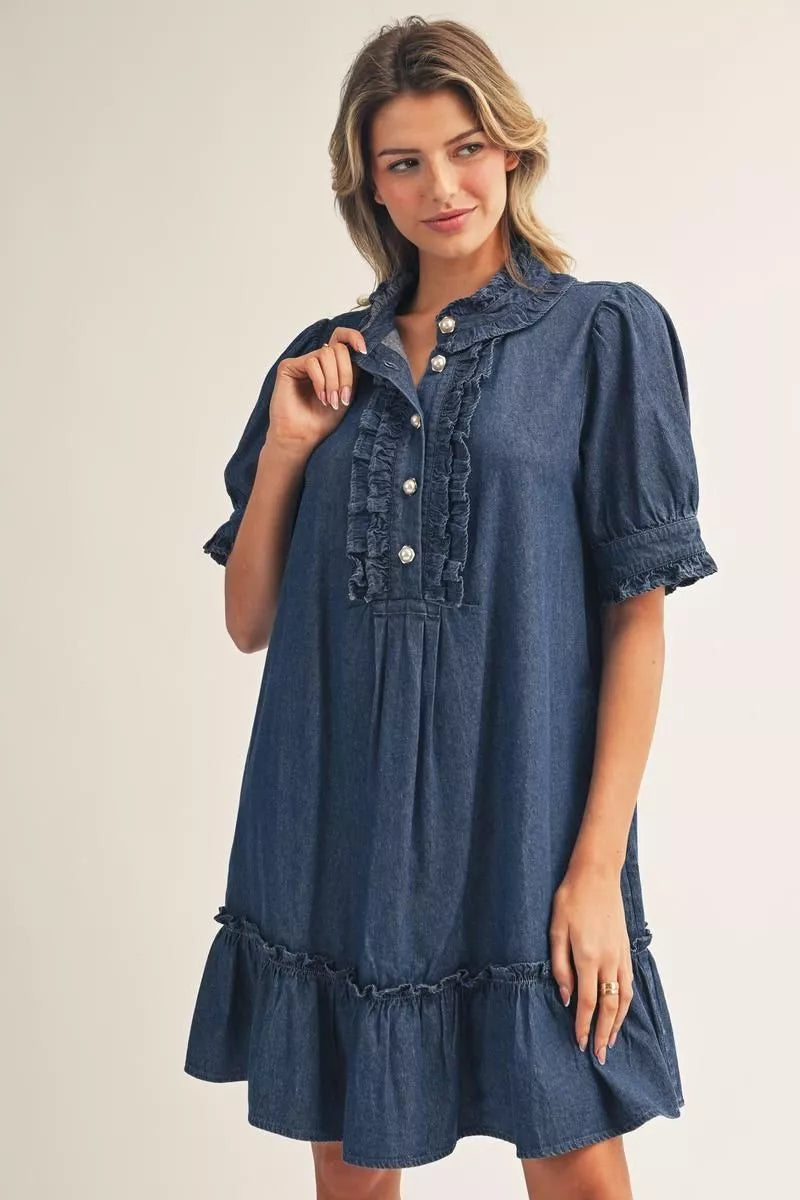 Dark wash Darcy Ruffle Denim Dress with short puff sleeves, ruffled collar, button front, and ruffled hem. Available in multiple sizes.
