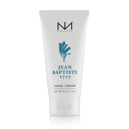 2.6 oz Jean Baptiste Travel Hand Cream in a white tube with blue plant graphic and logo, enriched with shea butter.