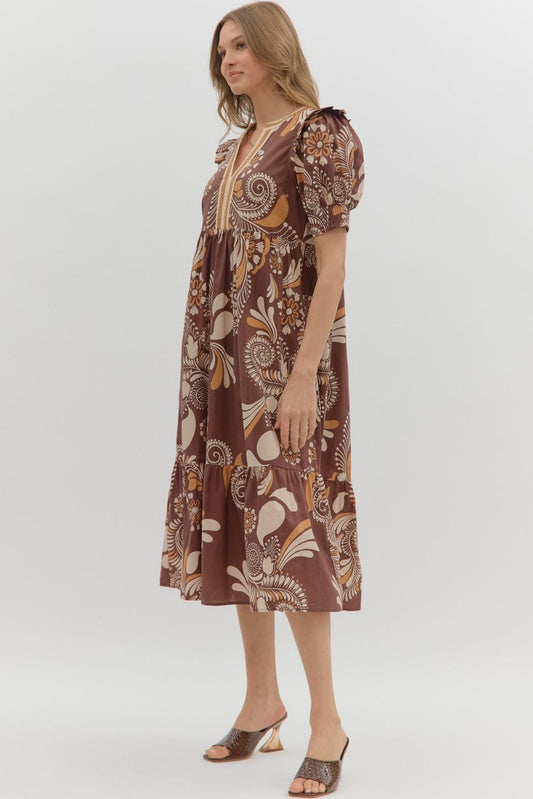 Betty Floral Dress: brown midi with cream and mustard floral swirls, puffed short sleeves, tiered skirt. Sizes XS-XL.