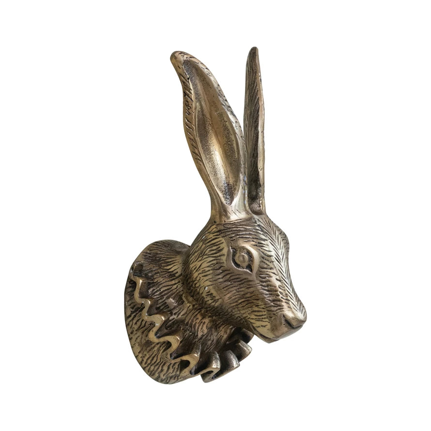 Wall-mounted rabbit sculpture with elongated ears and ruffled collar in antique brass; available in small and large sizes.