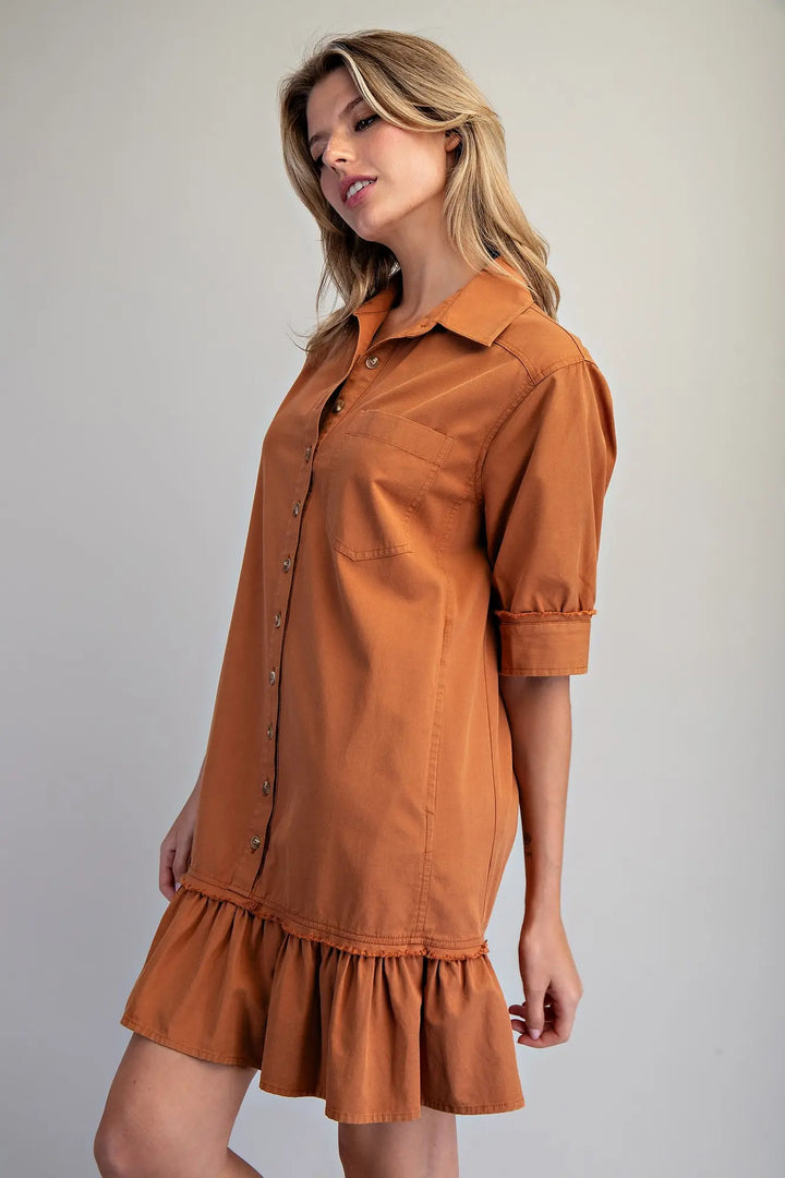 Clay Button Down Mini Dress in rust, cotton modal, ruffled hem, short sleeves. Available in XS–XL.