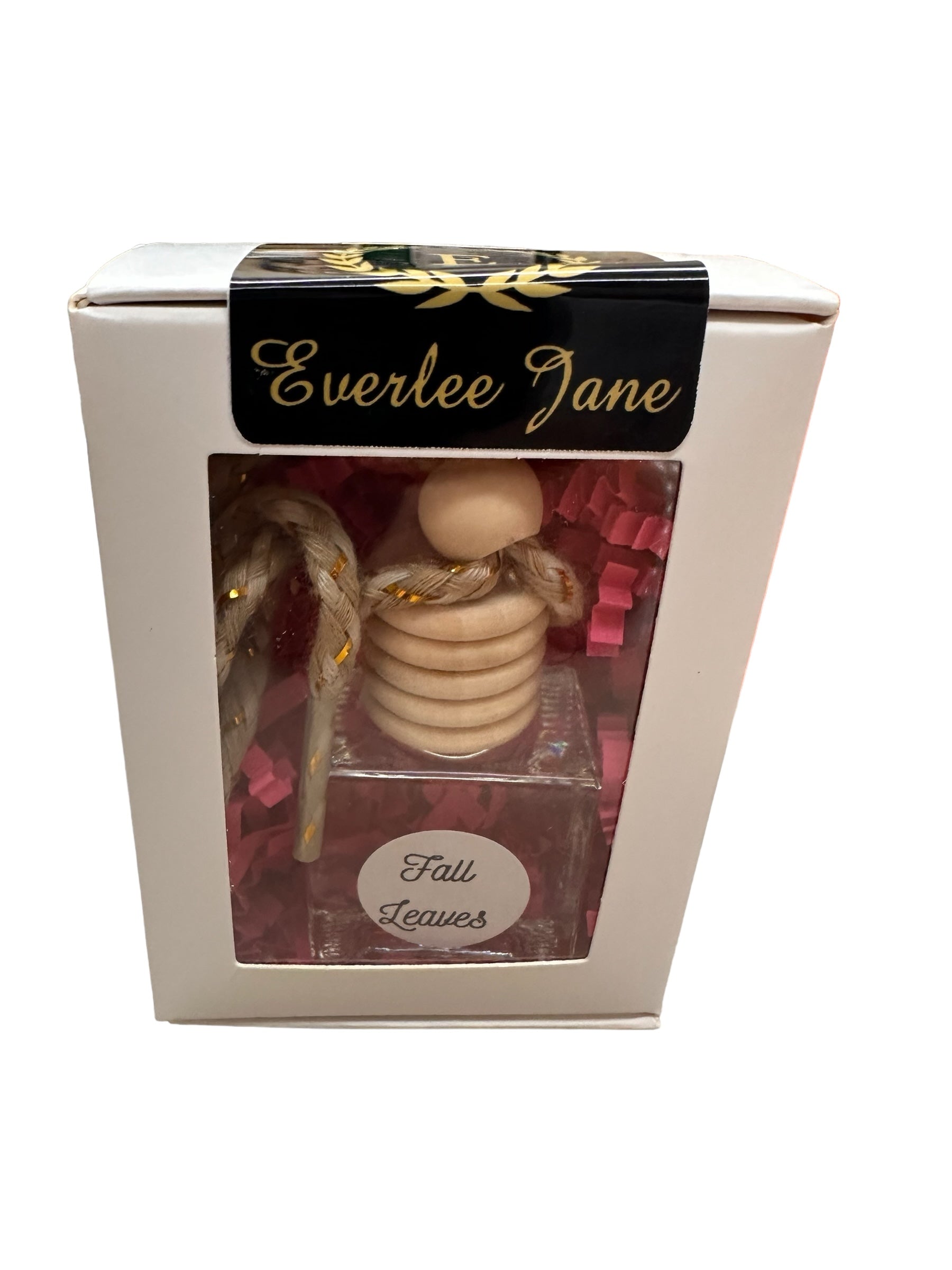 Car Diffusers": Packaged gift item with a wooden piece resembling honey dippers and a bottle labeled "Fall Leaves." Refreshing scent ideal for car use. Presented with pink shredded paper for added charm. Available size: one standard set.