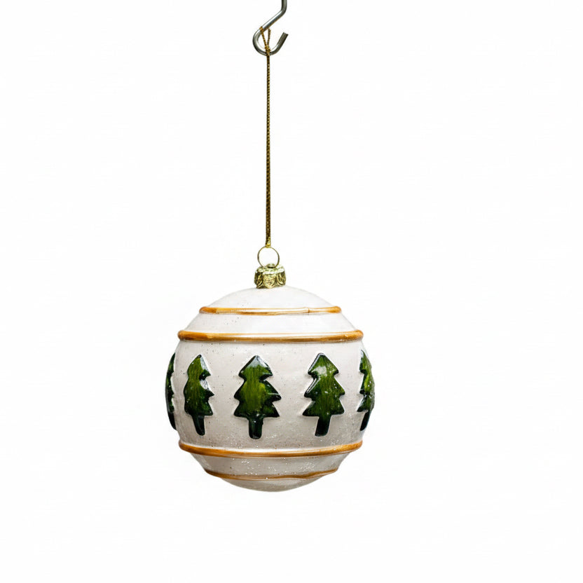 Westwood Ball Ornament: a cream round ornament with green painted trees and brown trim on a gold string.