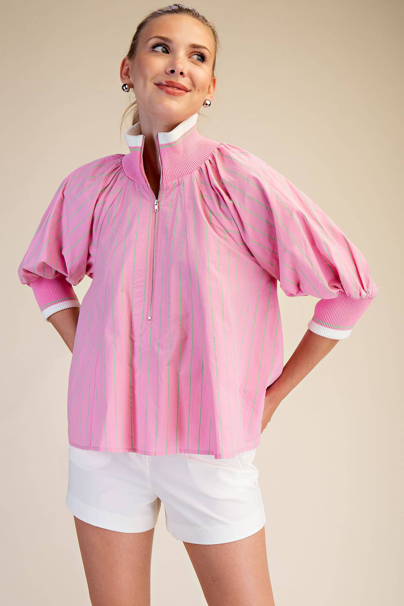 Pink Mock Neck Band Puff Sleeve Blouse with thin white stripes and white trim. Sizes: XS-XL.