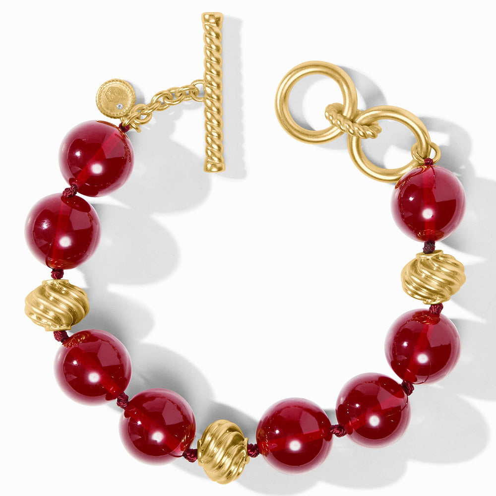 Ravello Cranberry Bracelet with alternating red spherical and textured gold beads, gold toggle clasp. Available in various sizes.