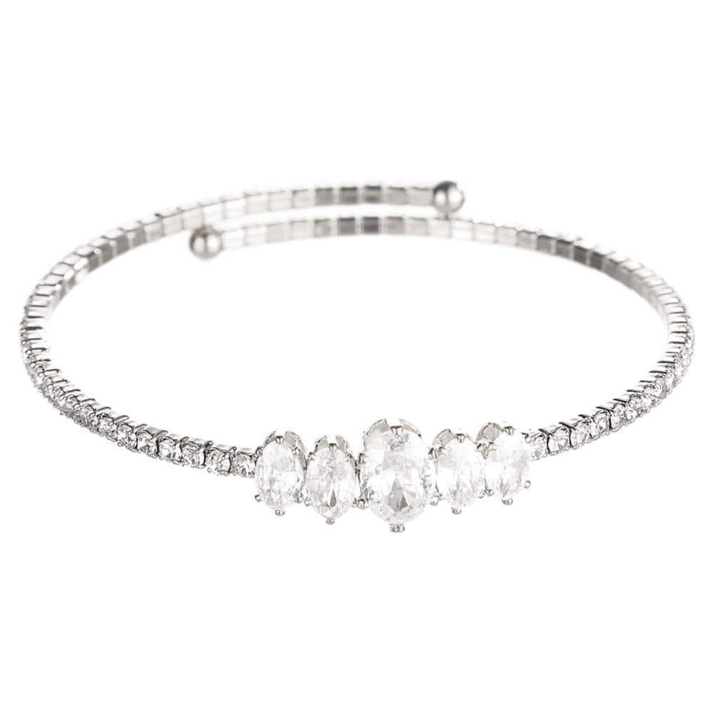 Delicate silver bangle with five oval clear gems and baguette crystals; available in S, M, L.