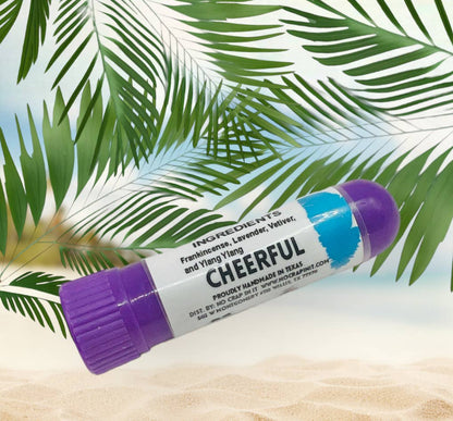 Purple-topped "Calm" essential oil inhaler with frankincense, lavender, vetiver, ylang-ylang; available in 1 ml and 2 ml sizes.