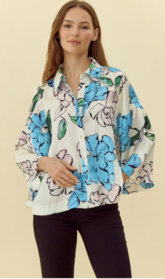 Satin Flower Top: Loose-fitting blouse with a collared neck and large floral pattern in blue, green, and pink on white. Available sizes: S, M, L.