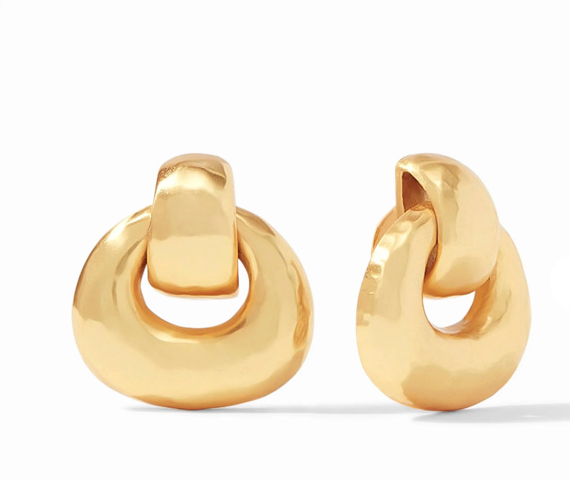 A pair of gold Avalon Door Knocker Clip Earrings featuring a unique twisted design. Available in one size.