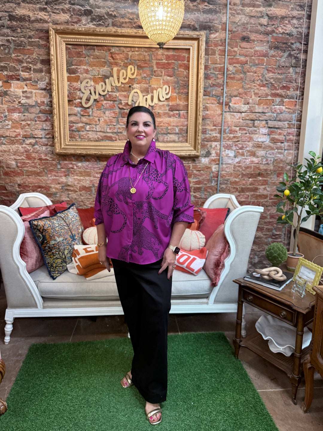 Magenta satin animal print top with long dolman sleeves. Available in sizes XS-XL.