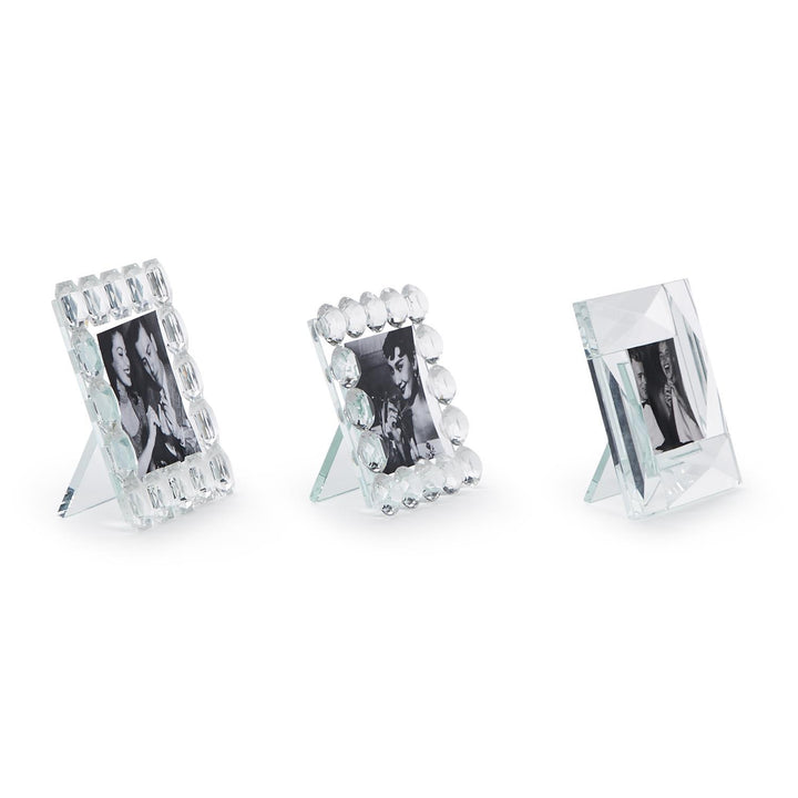 Three Brilliant Cut Crystal Frames with unique handcrafted designs, available in 4x6, 5x7, and 8x10 inch sizes.