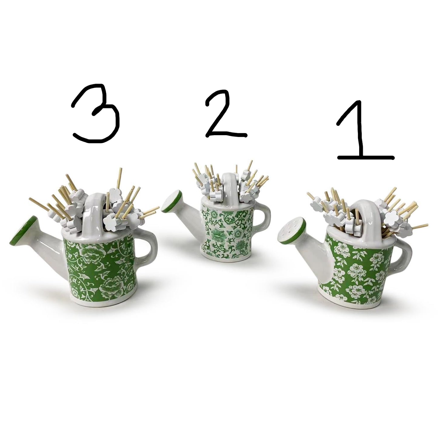 Mini watering cans with white floral designs and numbered flower picks. Sizes: 3, 2, and 1.