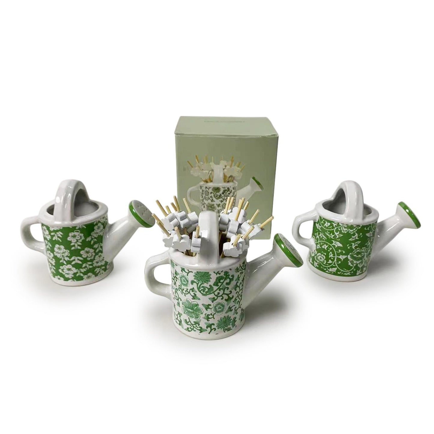 Set of three mini green floral watering cans with flower picks. Each can approx. 2" tall. Matching display box included.