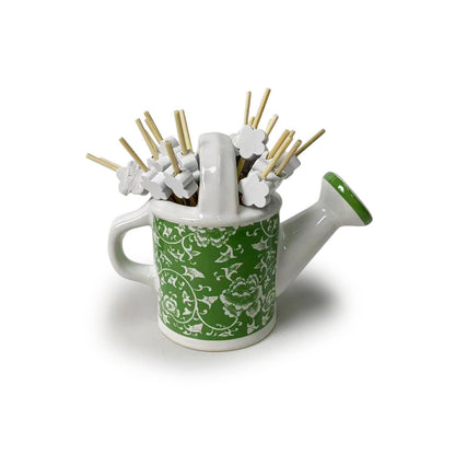 Green and white ceramic mini watering can with floral patterns, holds flower toothpicks; available in 2-inch and 3-inch sizes.
