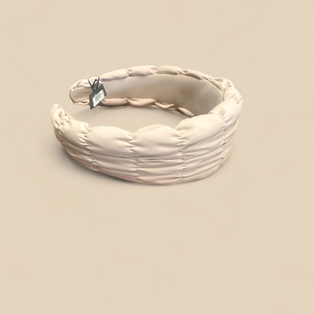 The Spring Headbands feature cream padded ruching and a small black tag. Available in sizes S, M, and L.