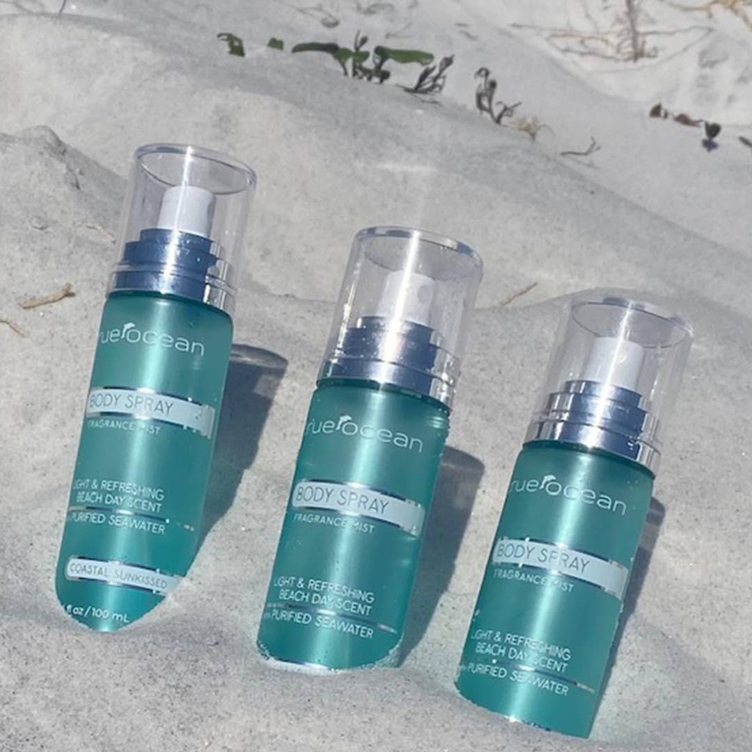 Three teal True Ocean Body Spray bottles, 3.4 oz each, with clear caps and silver accents. "Coastal Sunkissed Fragrance Mist.