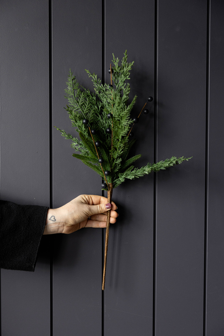 22-inch Navy Plum Berry Norfolk Cypress Real Touch Stem decorated with dark blue berries and cypress greenery.
