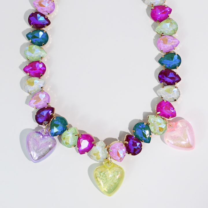 Faceted beads in purple, pink, blue, and green with three translucent heart charms; available in multiple sizes.